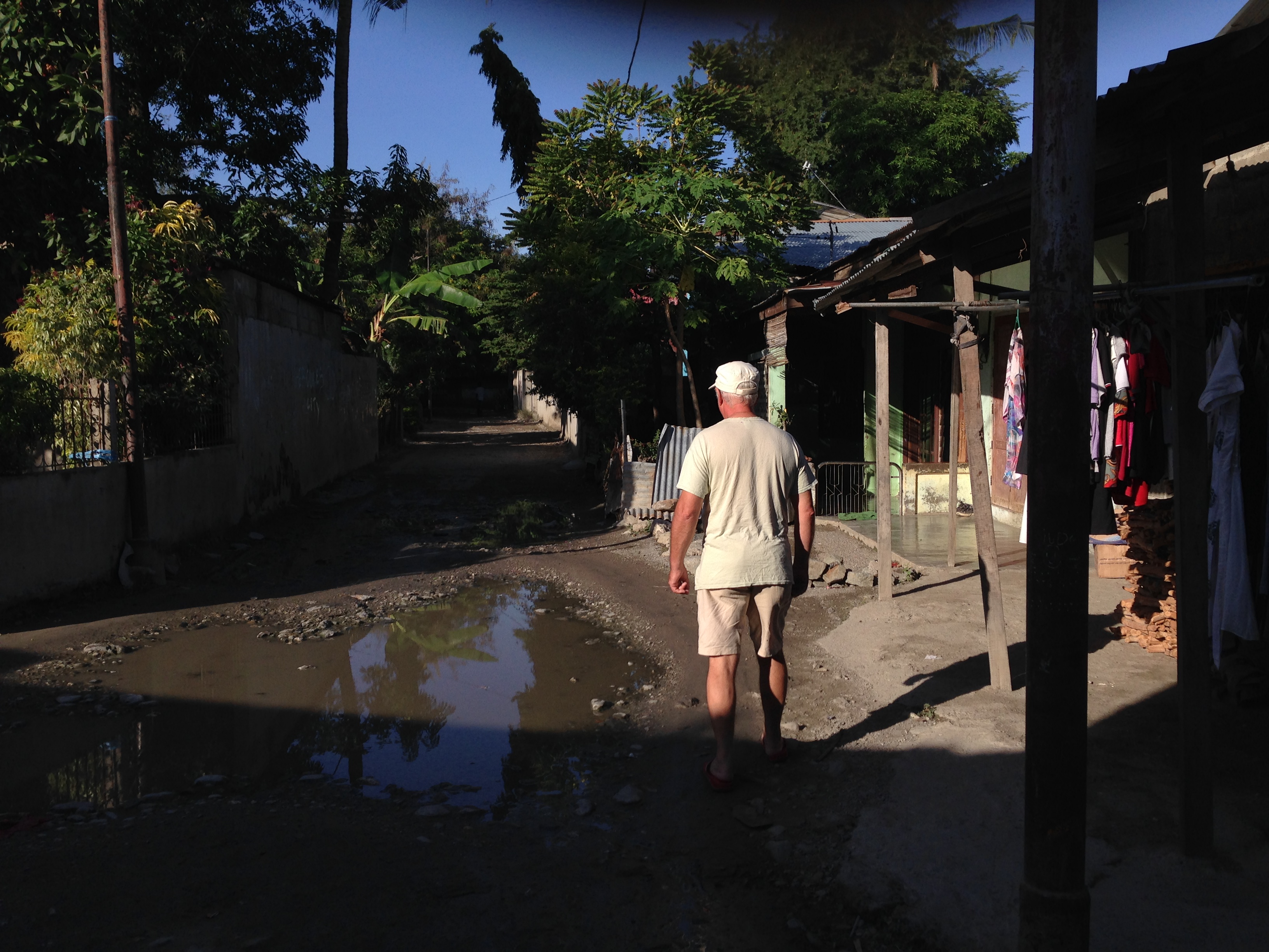 Dave walking the backstreets of Dili. Photo: Tim Holt