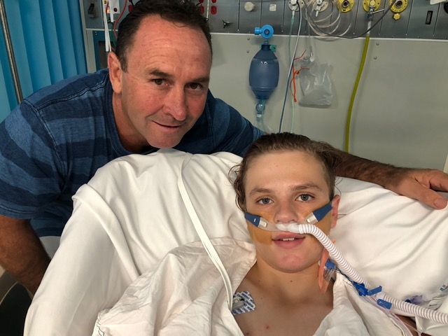 Ricky Stuart pays TJ a visit on Christmas morning in ICU. 