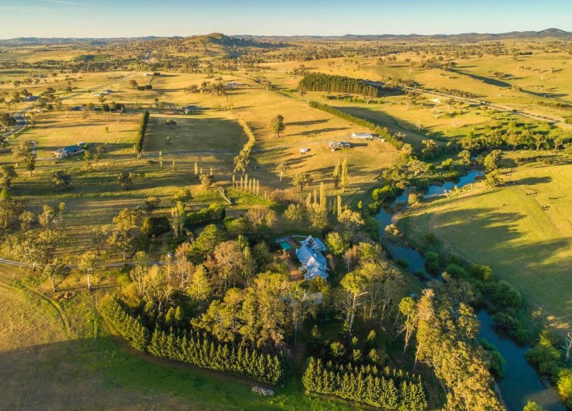 River frontage, rolling hills and a beautiful residence