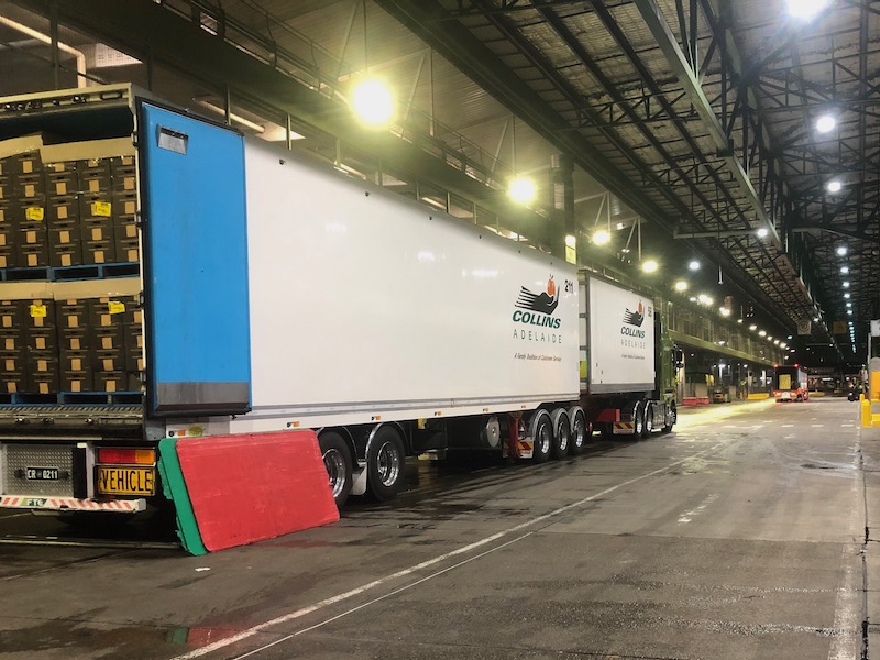 B-double truck unloading supplies at Sydney distribution centre.