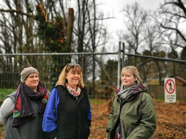 Three Bungendore residents in front of trees