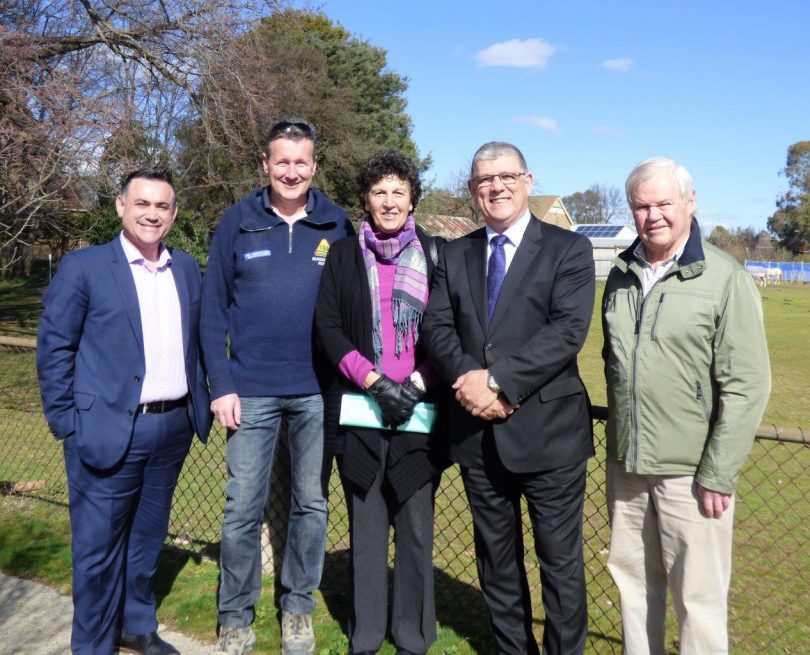 Member for Monaro John Barilaro, left, and former Minister for Ageing John Ajaka with committee members for the Abbeyfield project.