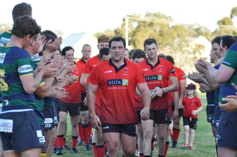 Young Yabbies players clapping off Josh Mann-Rea and Harden Red Devils players after rugby grand final.