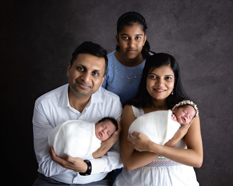 Namita Mittal and Tarun Jain with their twin babies and eldest daughter.