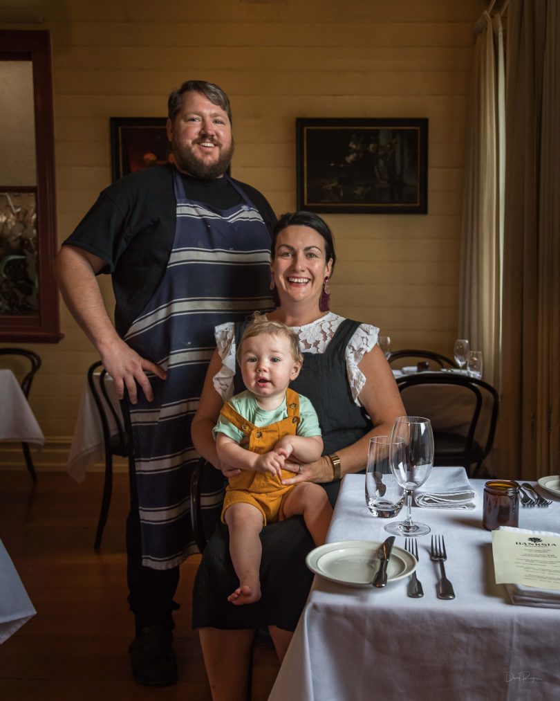 Huw Jones, Renee Loftus and their son, George, inside Banksia Restaurant in Pambula.