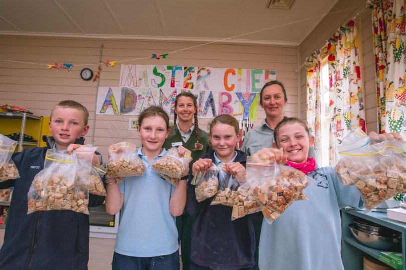 Students with bags of bogong bickies