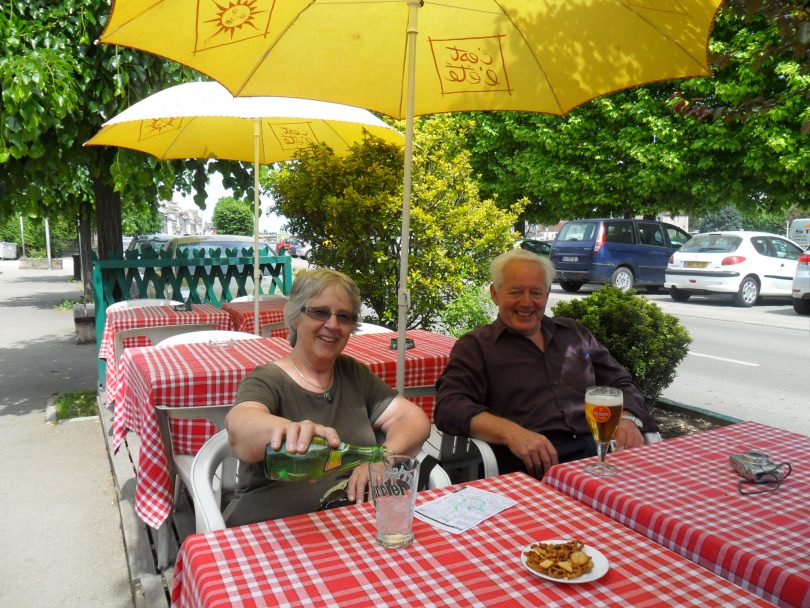Daphne and David Penalver relaxing at an outdoor cafe at Ameins, France.