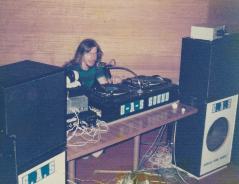Doug Rawlinson controlling turntables at a 1970s disco.