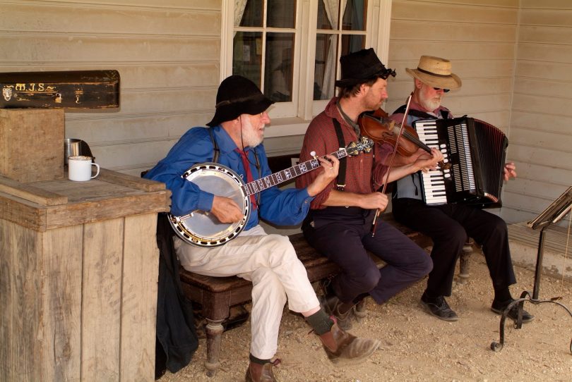 Trio of musicians playing