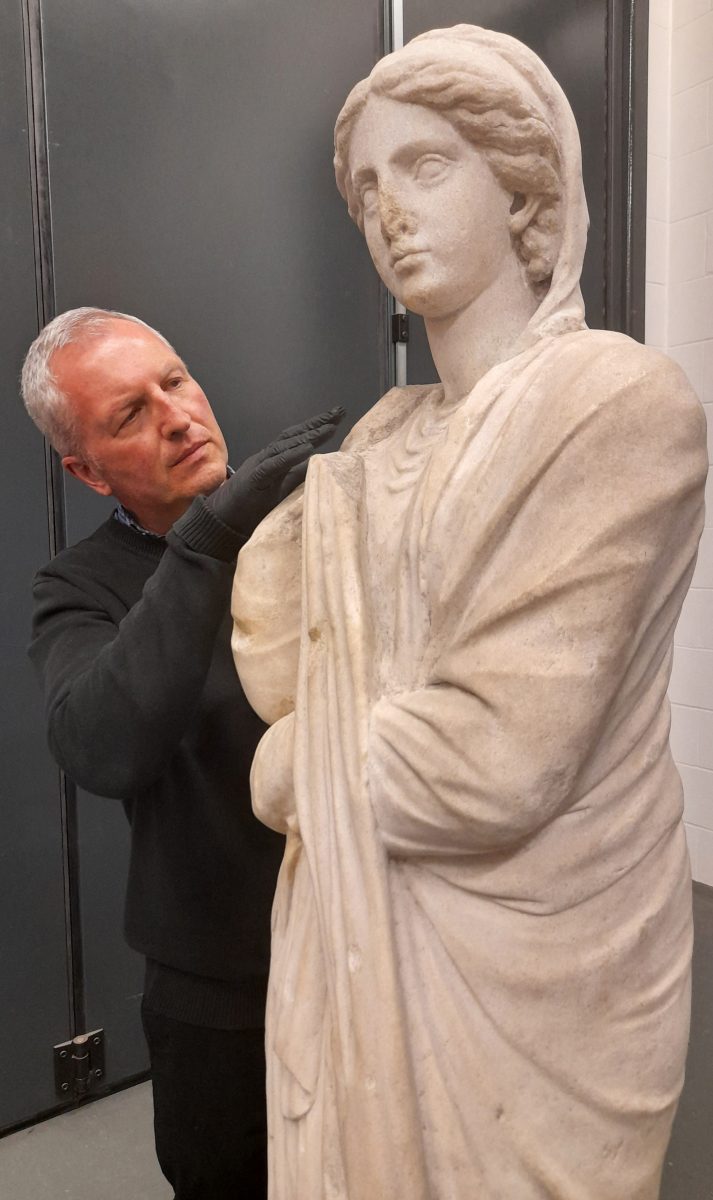 Dr Peter Higgs with ancient Greek statue of woman