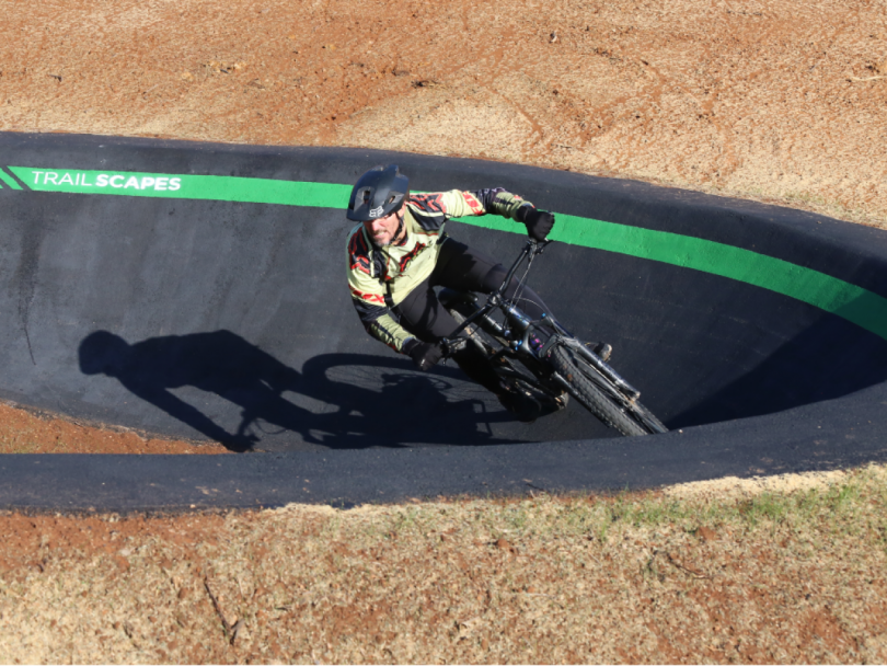 Rob Owers riding bike on pump track at Wagga Wagga Multisport Cycling Complex