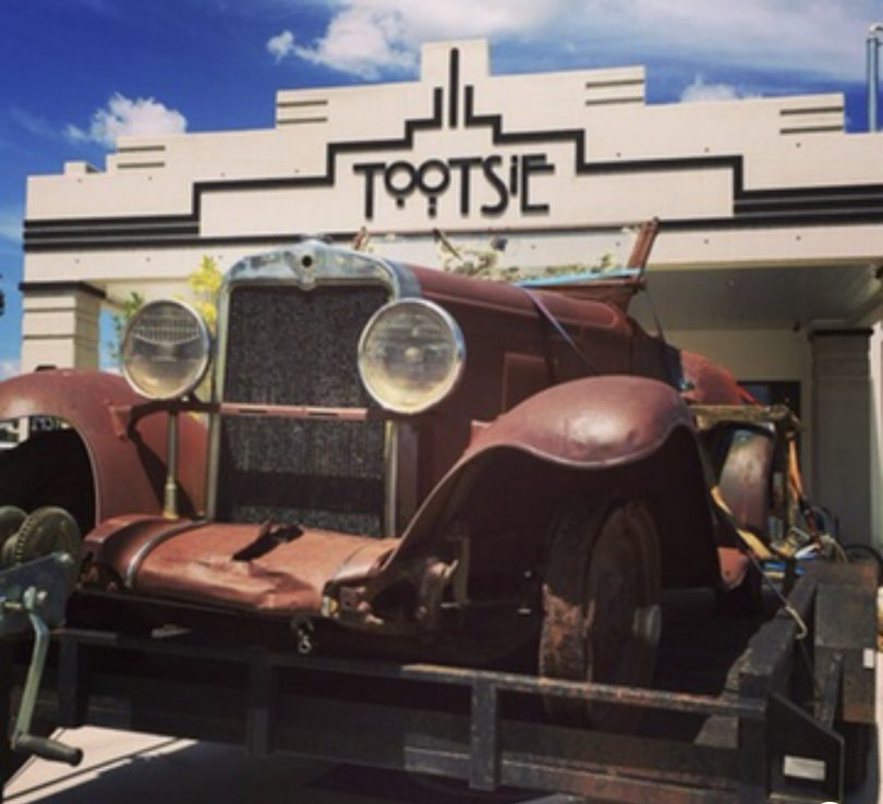 Vintage car outside Tootsie cafe in Yass