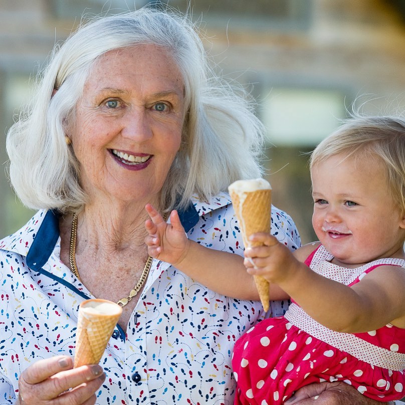 Sandra McCuaig holding young child with ice cream
