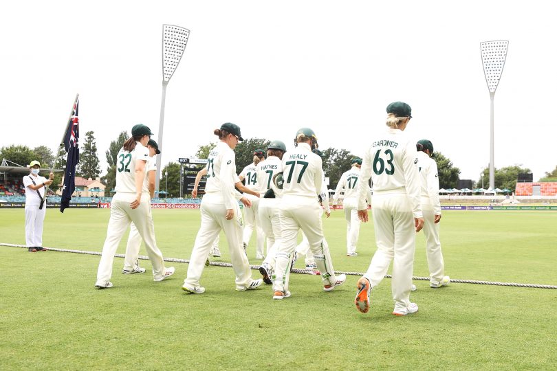 The Australian team take the field during day two of the Women's Test match in the Ashes series between Australia and England at Manuka Oval on January 28, 2022. Photo: Mark Kolbe/Getty Images. With permission from Cricket ACT.