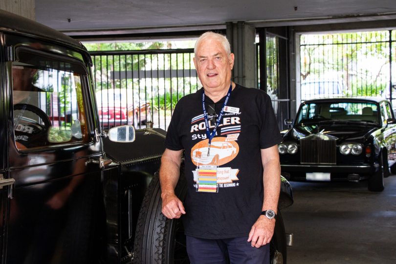 Man standing next to car