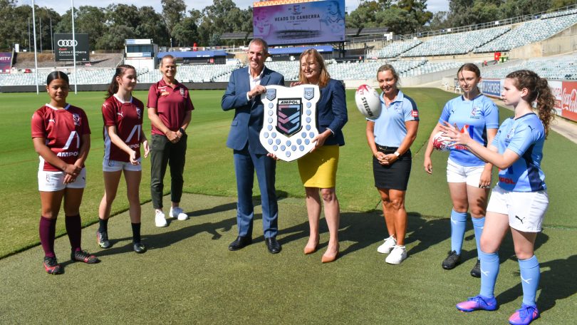 Don Furner and Yvette Berry with representatives of Queensland and NSW Women's Rugby League teams at the announcement of Canberra Stadium to host a Women's State of Origin game in June. Photo: Raiders.
