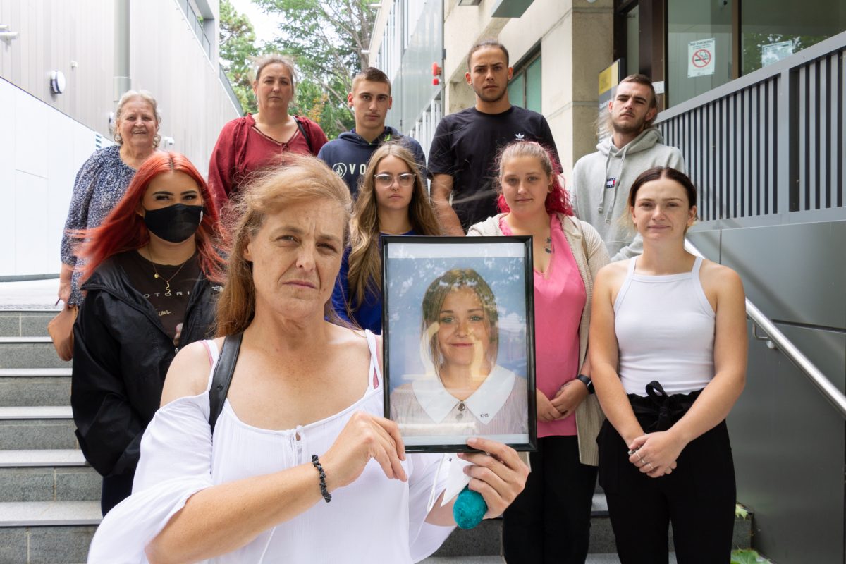 Group of people with a picture of a young girl