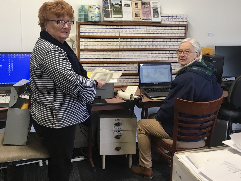 Annette Murphy and Helen Dawson work on a library of film records.