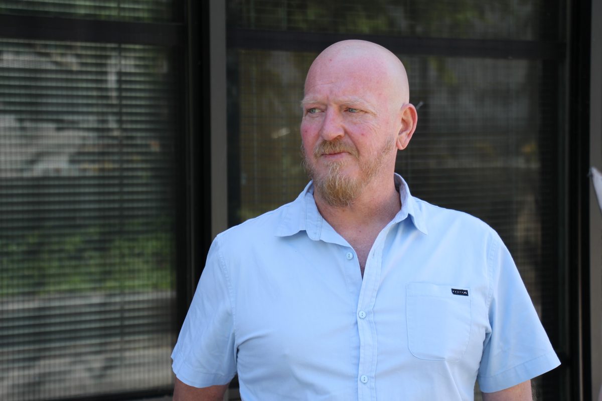 Man in blue shirt outside court