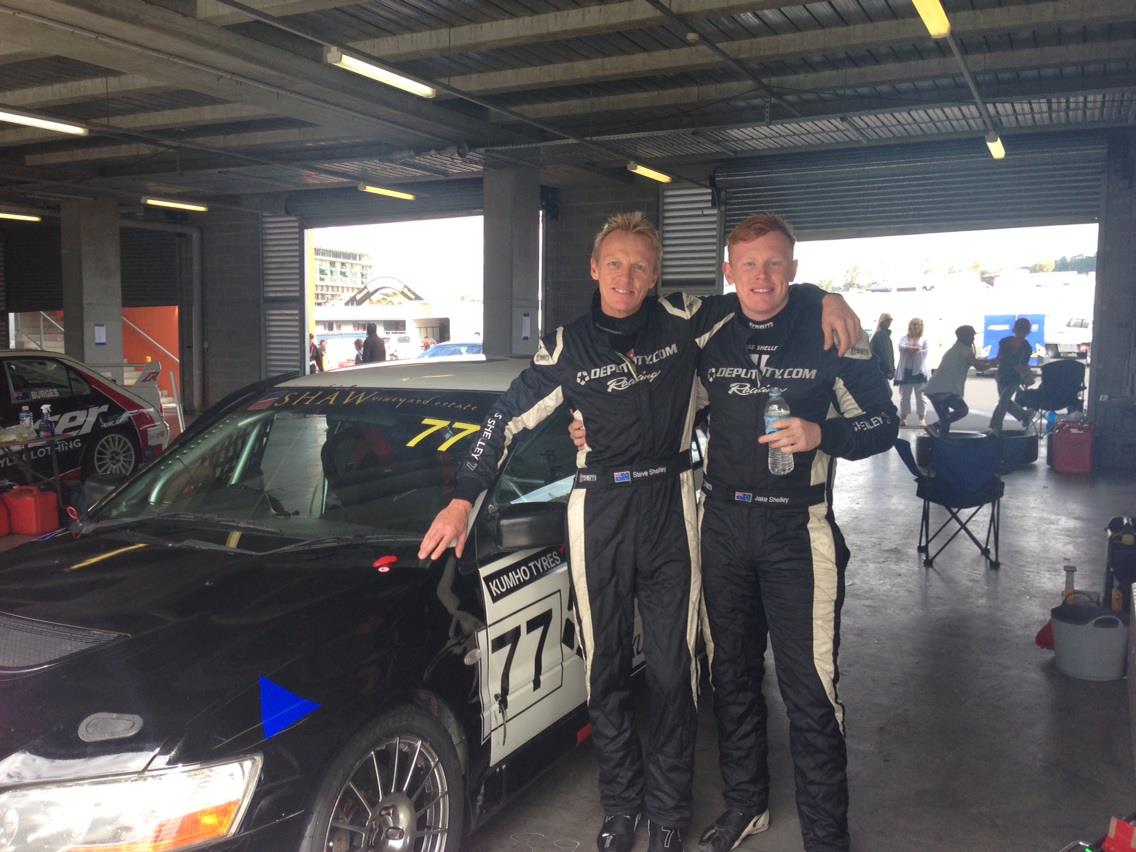 Steve Shelley with his son Jake in a garage at a racetrack