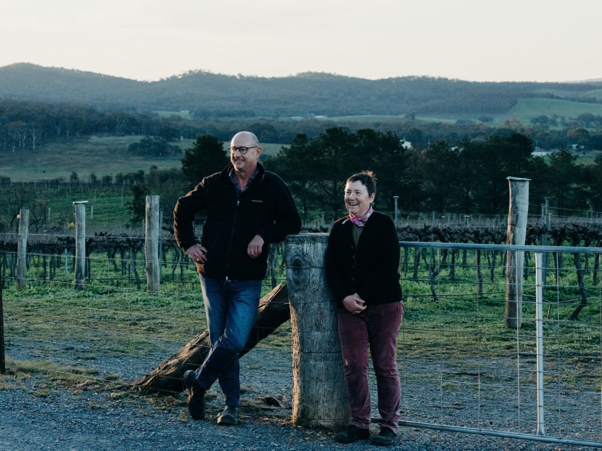 two winemakers standing in Vinyard