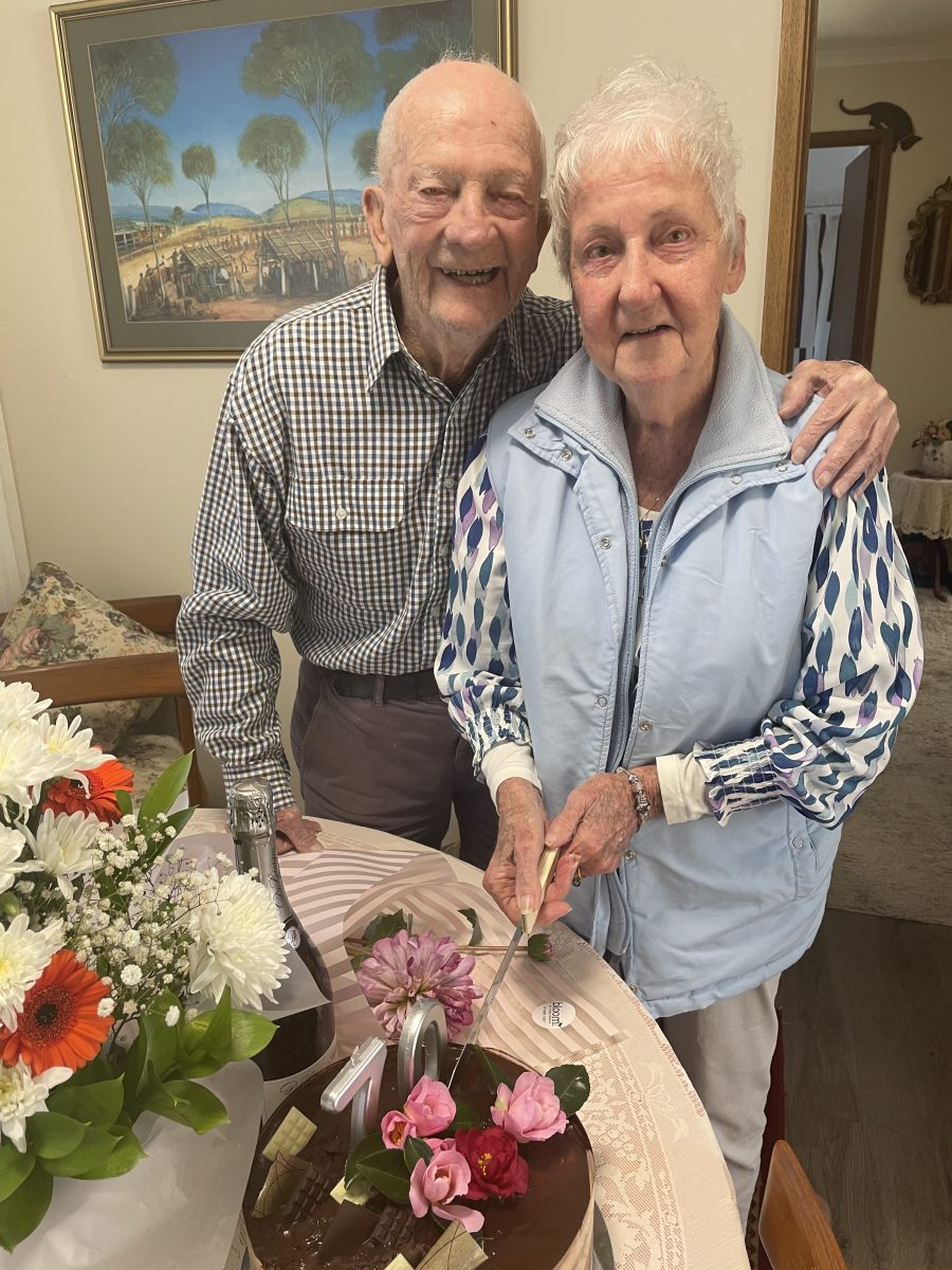 Couple cutting 70th cake