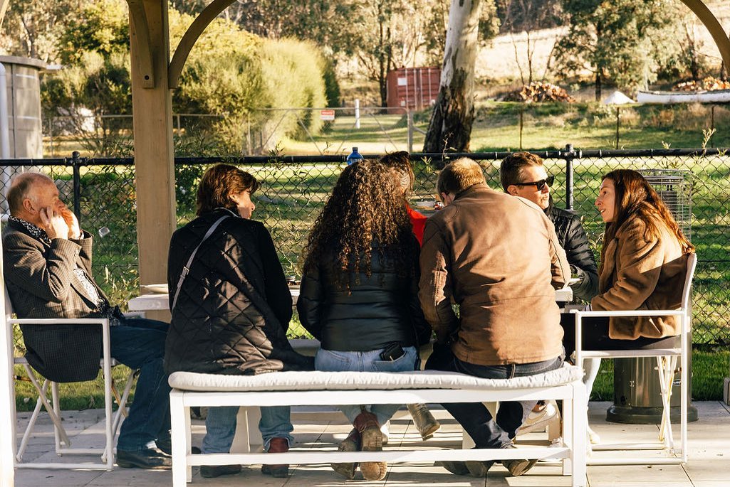 A group of people sitting around a table