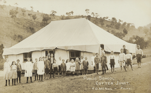 Cotter public school. Children are pictured in front of the first Cotter River Public School, which was in a tent.