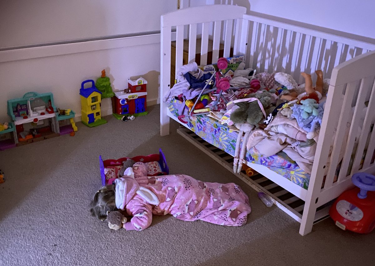 child sleeping on the ground