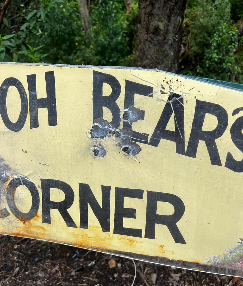 sign at Pooh Bear's Corner with shotgun damage