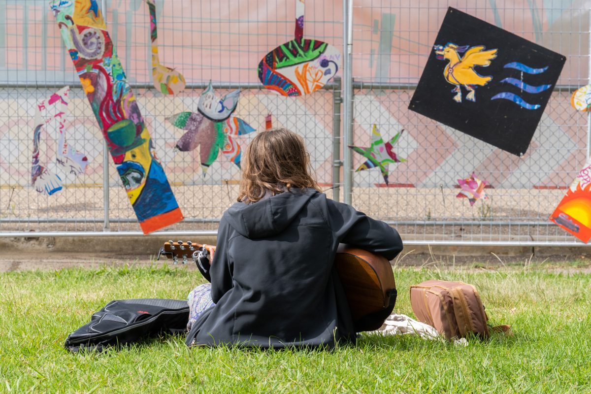 Person playing a guitar