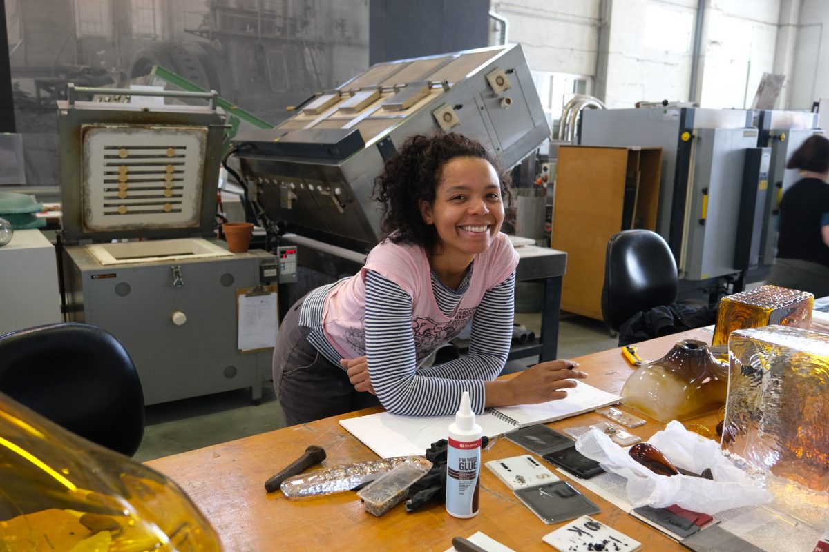 Woman behind artist's bench