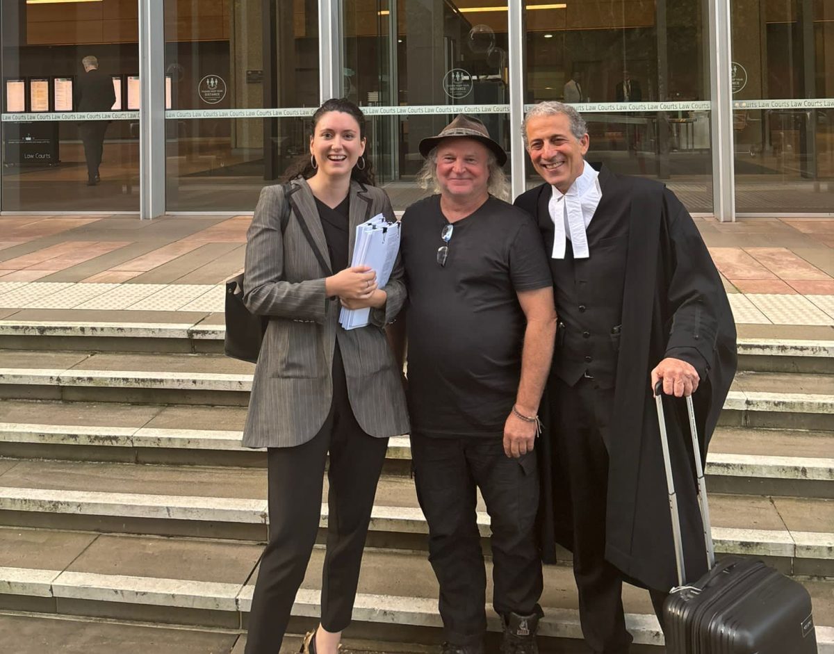 barrister and two other people outside court