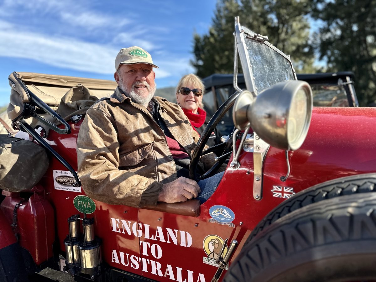 Couple riding in a vintage car