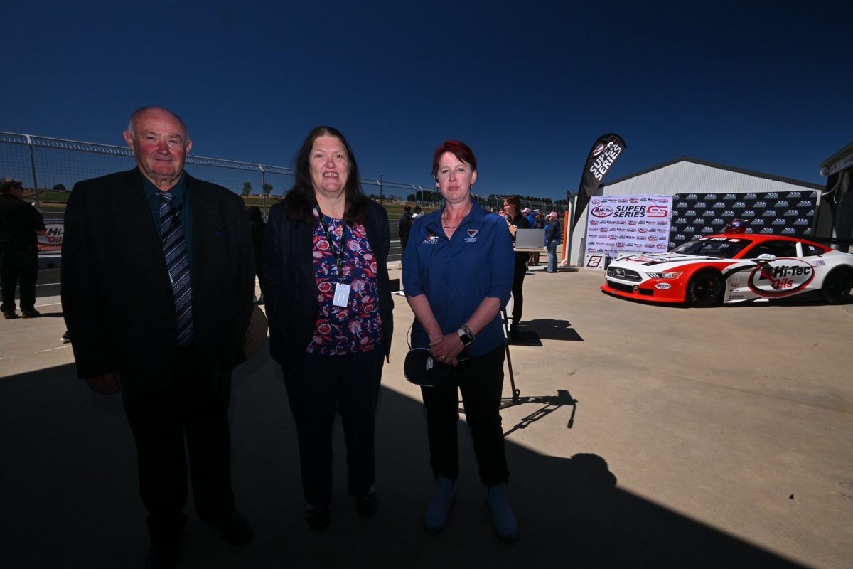 three people at racetrack