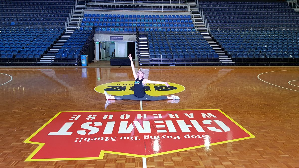 Carly Wilson doing the splits on AIS court