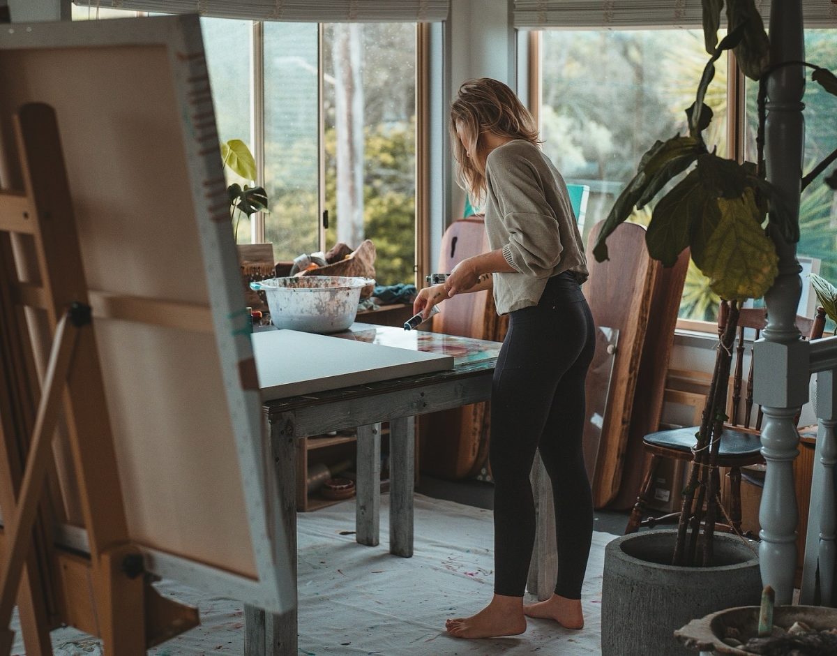 woman painting in studio