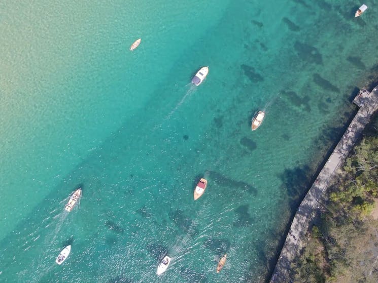 boats sailing on shallow blue water