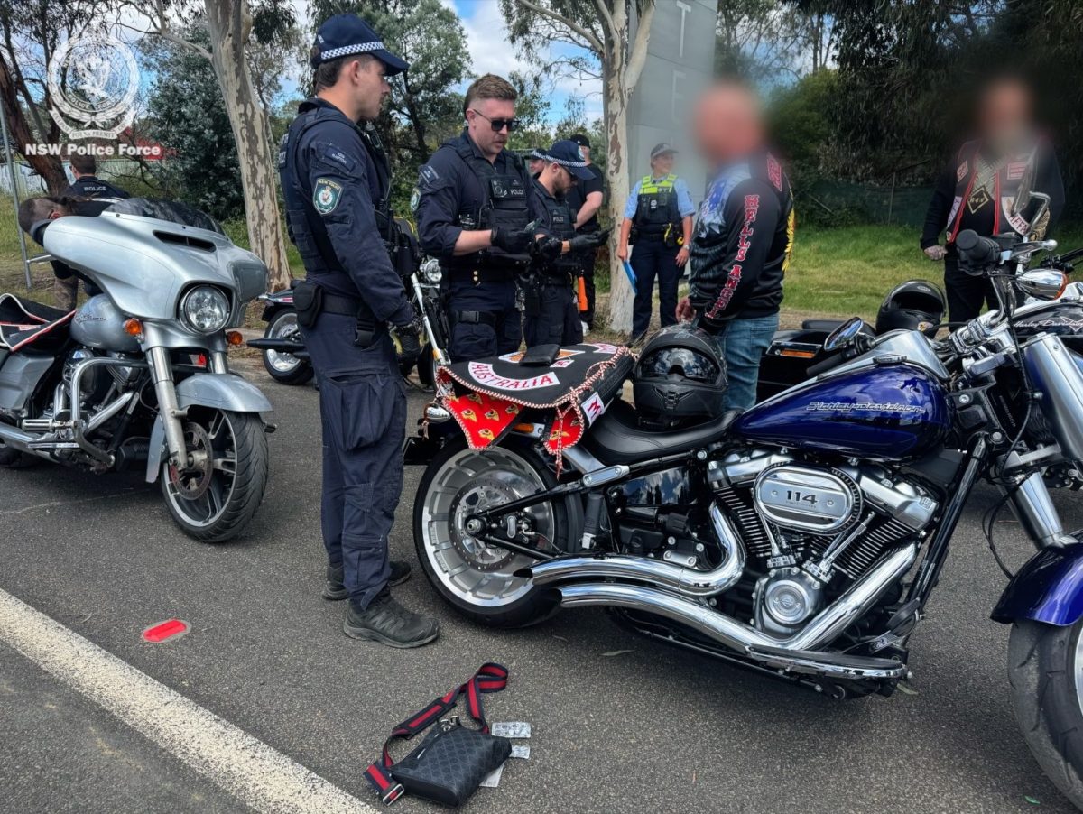 police officers with hells angels member and motorbikes