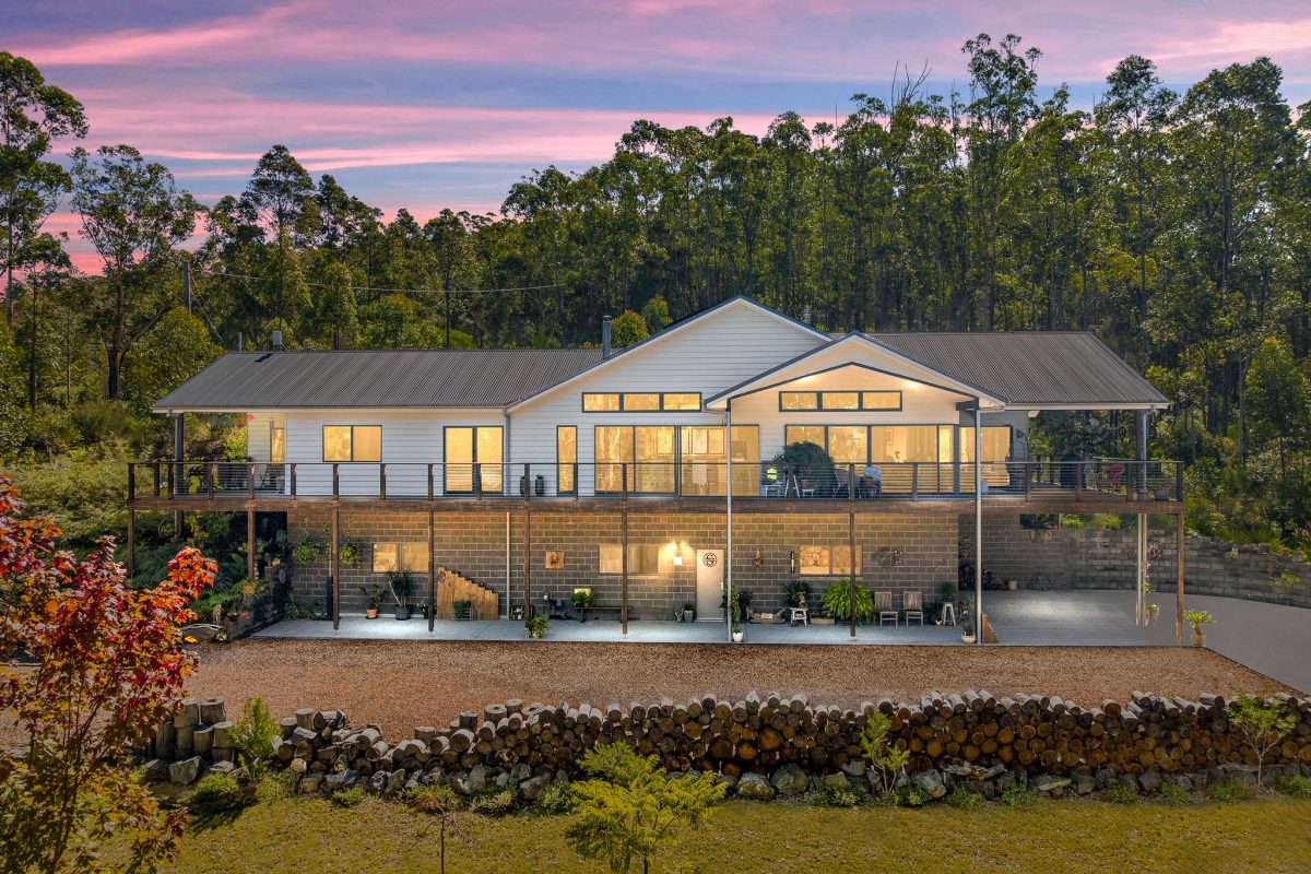 front of home view at sunset