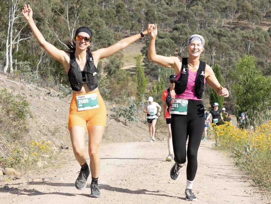 two women running