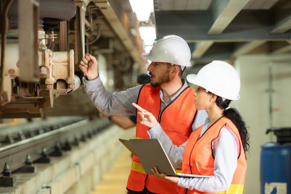 Male and female engineers work together in an electric repair station