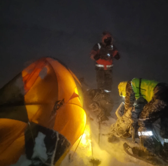 tent in the snow at night