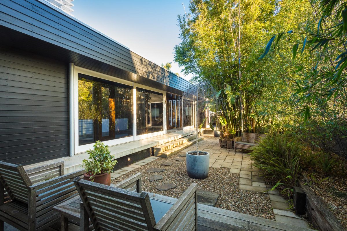 Asian-inspired courtyard with bamboo and pebbles