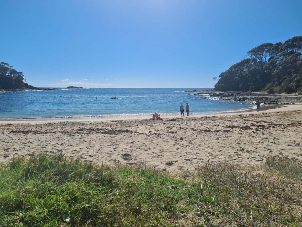 A landscape photo of Lilli Pilli beach taken looking out onto the water.
