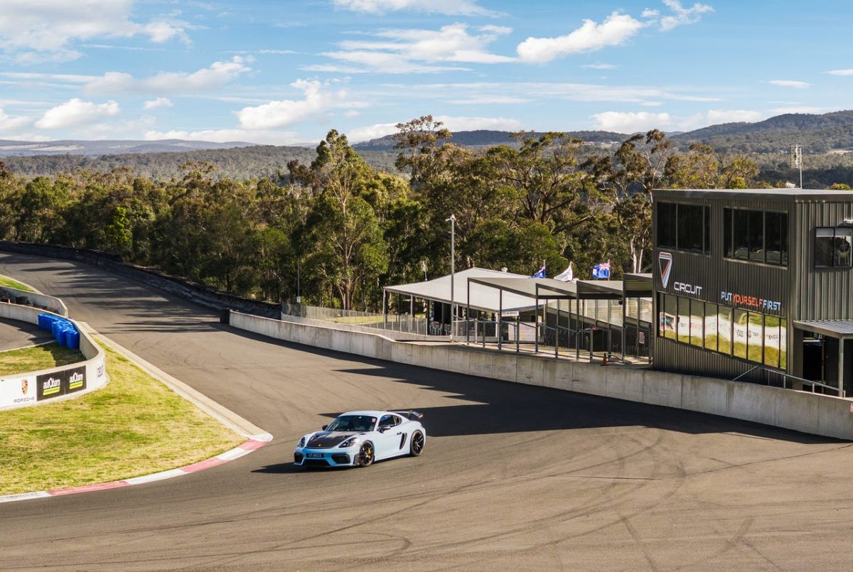 A sports car negotiating a turn on a racetrack