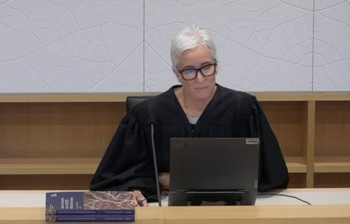 The NSW State Coroner Teresa O'Sullivan reading off her laptop announcing the summary of the final recommendations of the NSW Bushfire inquiry.