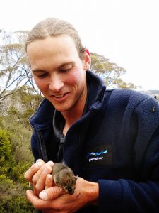 Mark Feeney with a Mountain Pygmy Possum. Image by Mel Schroder