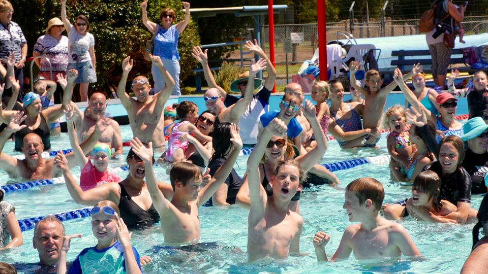 People cheering in a pool in Batemans Bay.