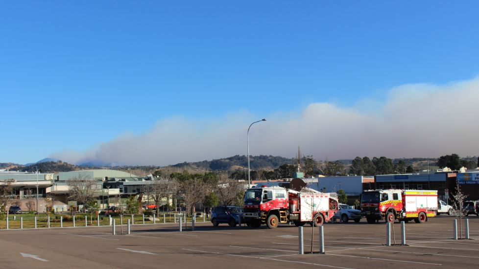 A less intense smoke plume this morning (Aug 16 8am). Crews from Cooma and Jindbayne NSW Fire and Rescue in Bega to help fight the Yankees Gap Road Fire. Photo: Ian Campbell.